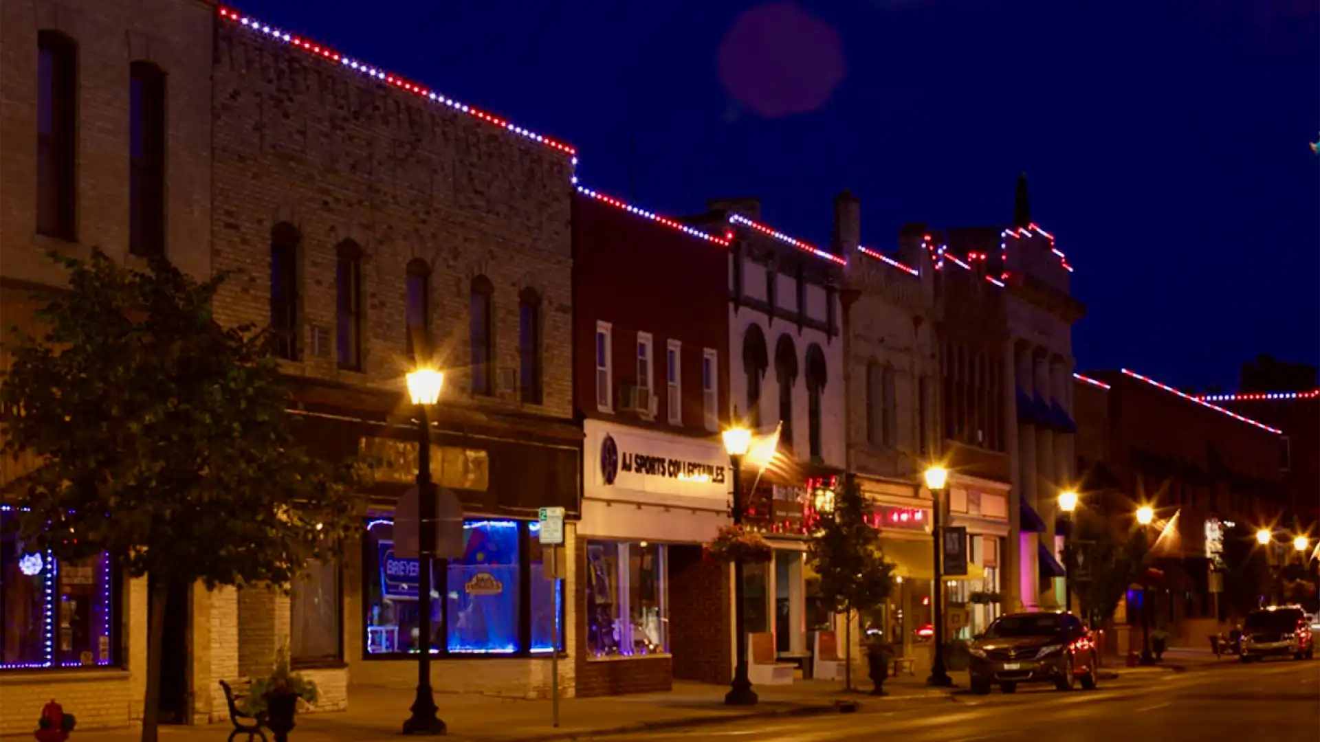 pedestrian walkway in a downtown district after dark